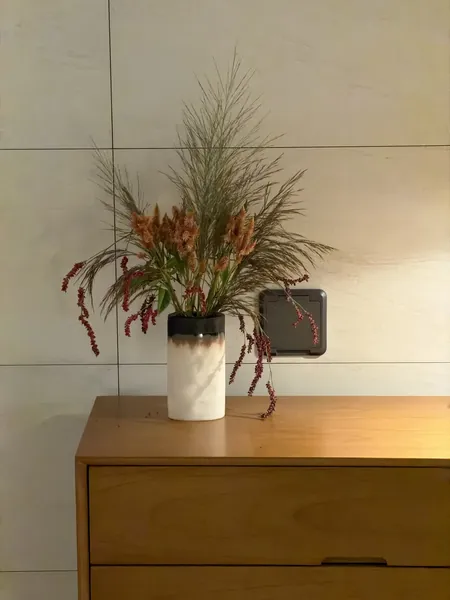 Autumn grasses with orange celosia