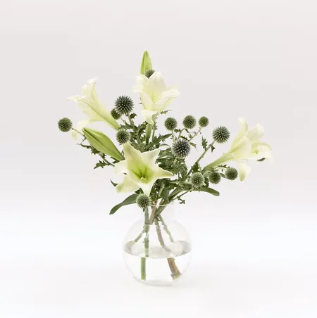 White lilies with globe thistle